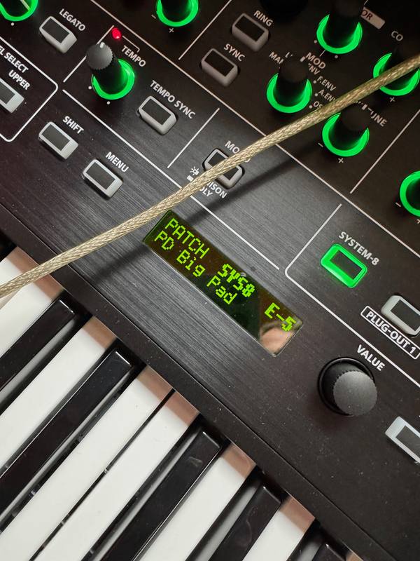 Close-up of a synthesizer display reading PD Big Pad